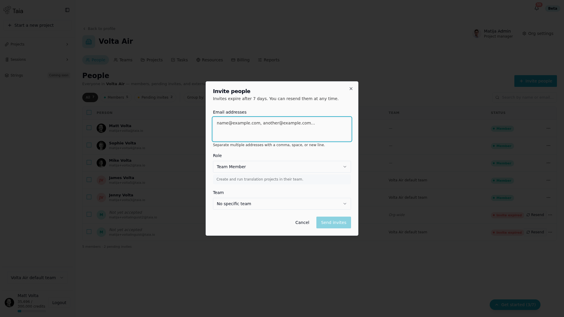 Invite people dialog — email addresses, role, and team selector